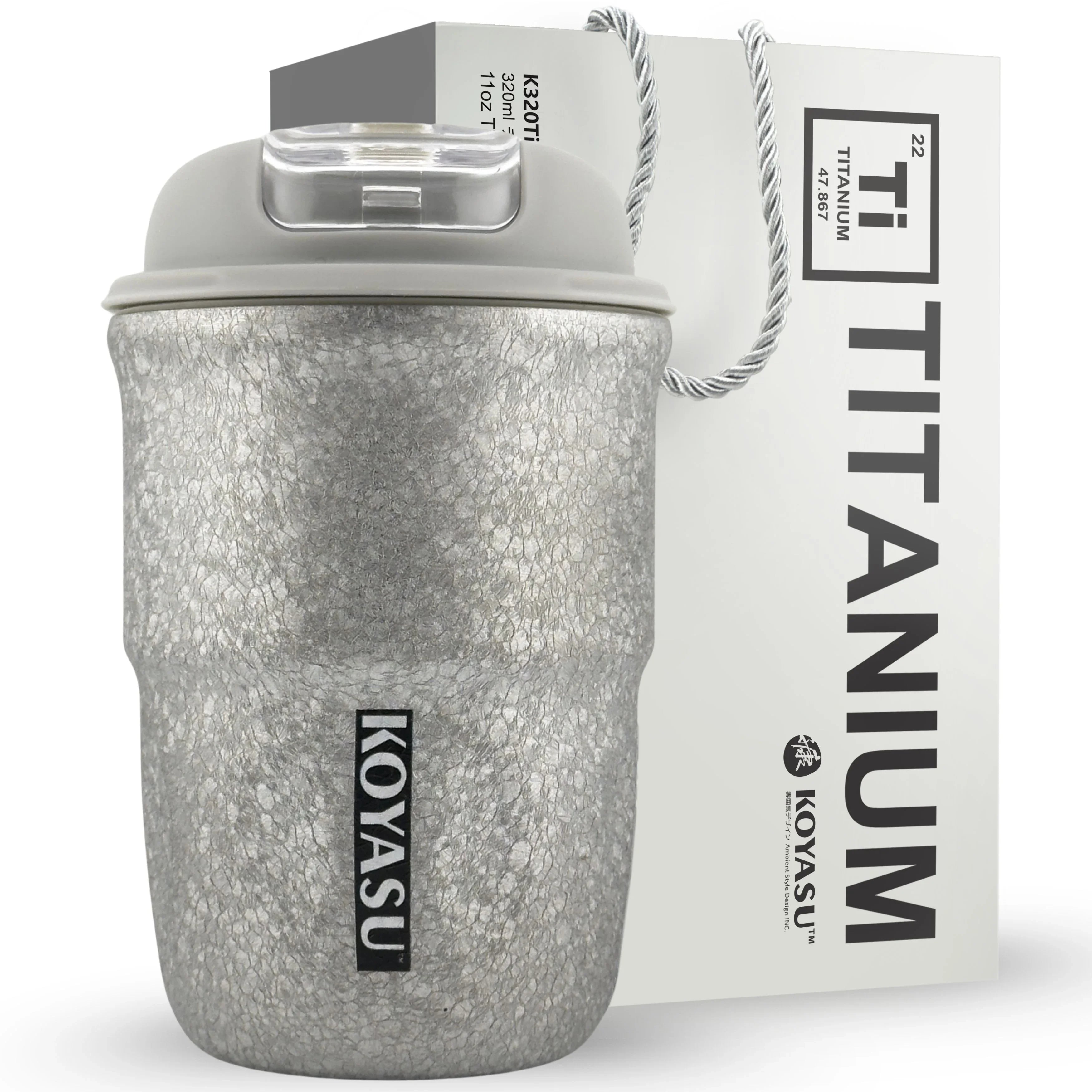 KOYASU 12oz titanium-lined cup-mug-tumbler-thermos-bottle in Outdoor Gray, shown on a brunch table beside a breakfast plate. Features uncoated interior for safe, pure flavor.