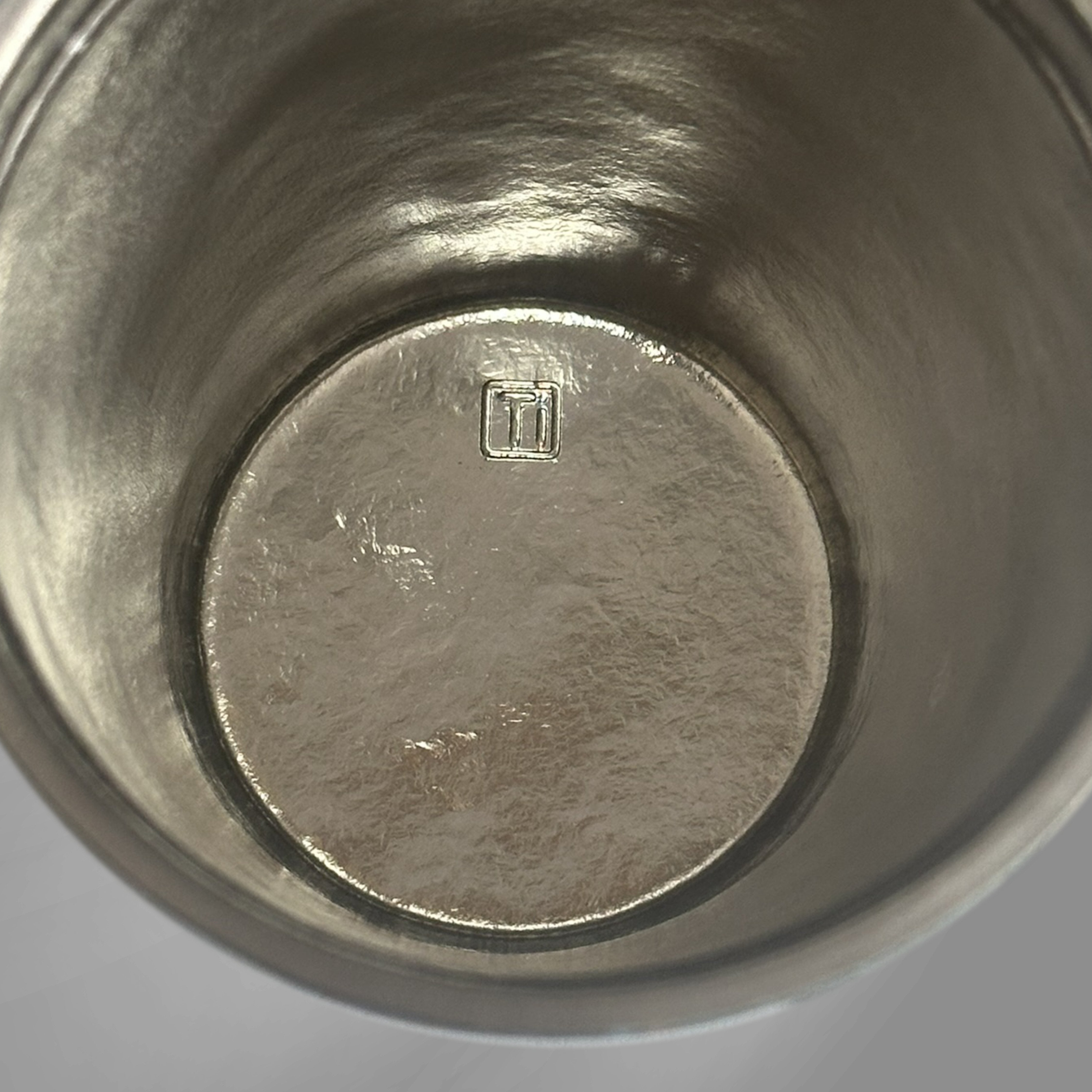 Inside view of KOYASU Ti-Zen Pure Titanium Mug showing uncoated medical grade metal interior no lining